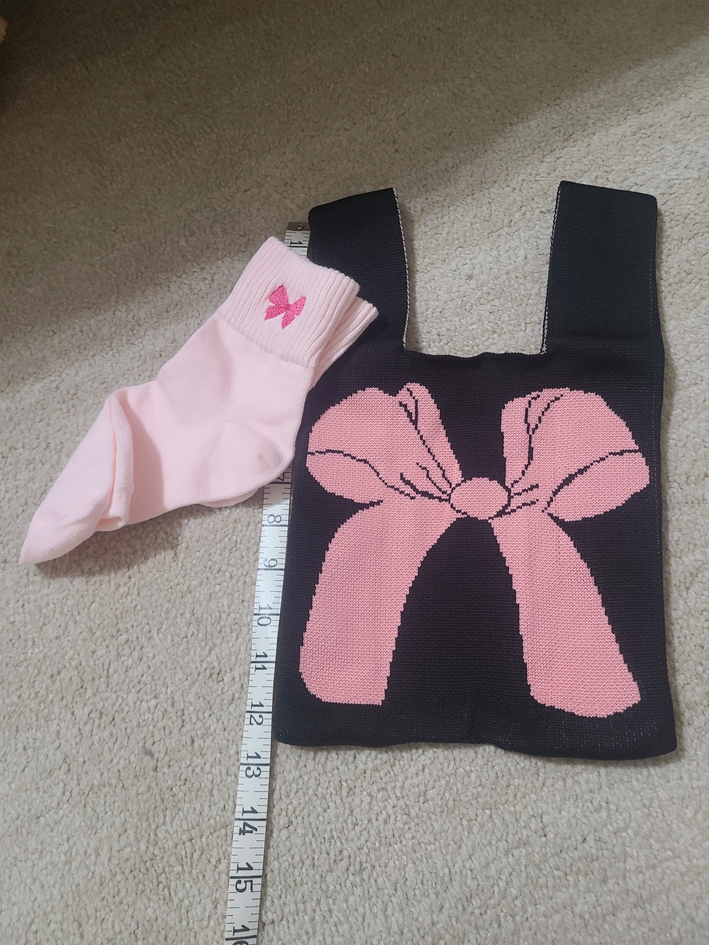Black Knit Bag with Pink Bow Graphic paired with pink socks